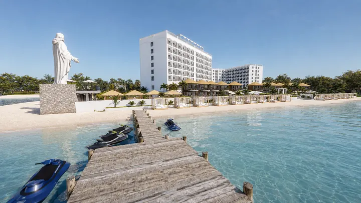 Timber jetty and personal watercraft facing the beachfront cabanas and residences