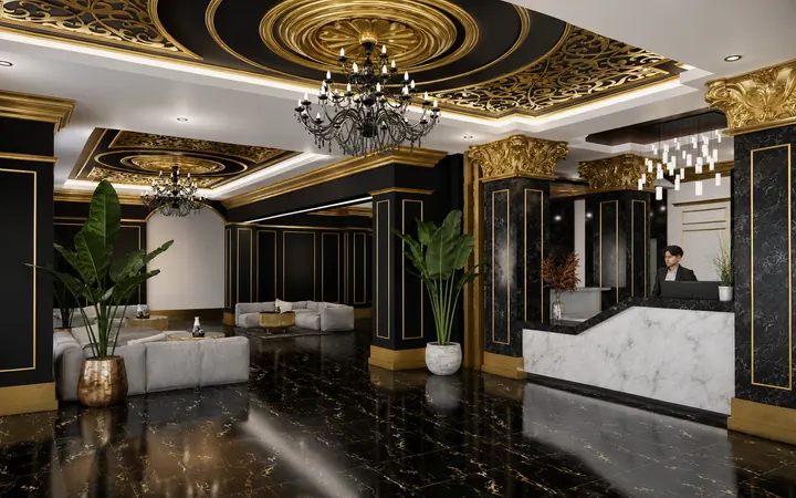 Black-and-gold reception lounge with chandeliers, marble columns and gray sofas