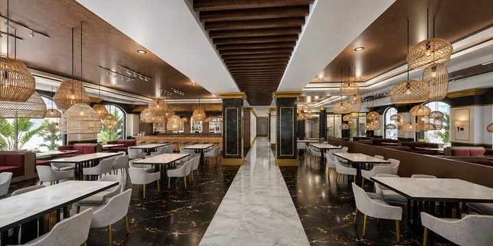 Restaurant with woven pendant lights, marble tables, upholstered seating and a central marble aisle